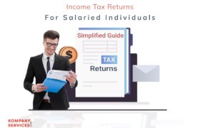 A man in glasses and a dark suit smiles while holding documents. In the background, an illustration shows a tax form and an envelope. Text above reads, "Income Tax Returns for Salaried Individuals - Simplified Guide." The "Kompany Services" logo is in the lower left.