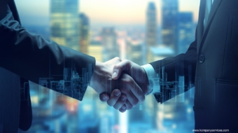 Two people in business attire shake hands, symbolizing a limited partnership or agreement. The background features a blurred cityscape, and digital overlays of city buildings are visible over their hands, suggesting innovation or technological collaboration.