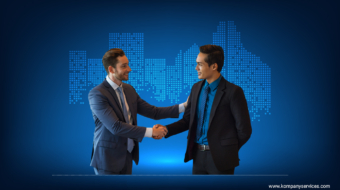Two business professionals shaking hands and smiling against a blue background with pixelated graphics of a city skyline, highlighting their new Partnership Firm Registration. One man is in a gray suit and blue tie, the other in a black suit and blue shirt. The website "www.kompanyservices.com" is visible at the bottom.