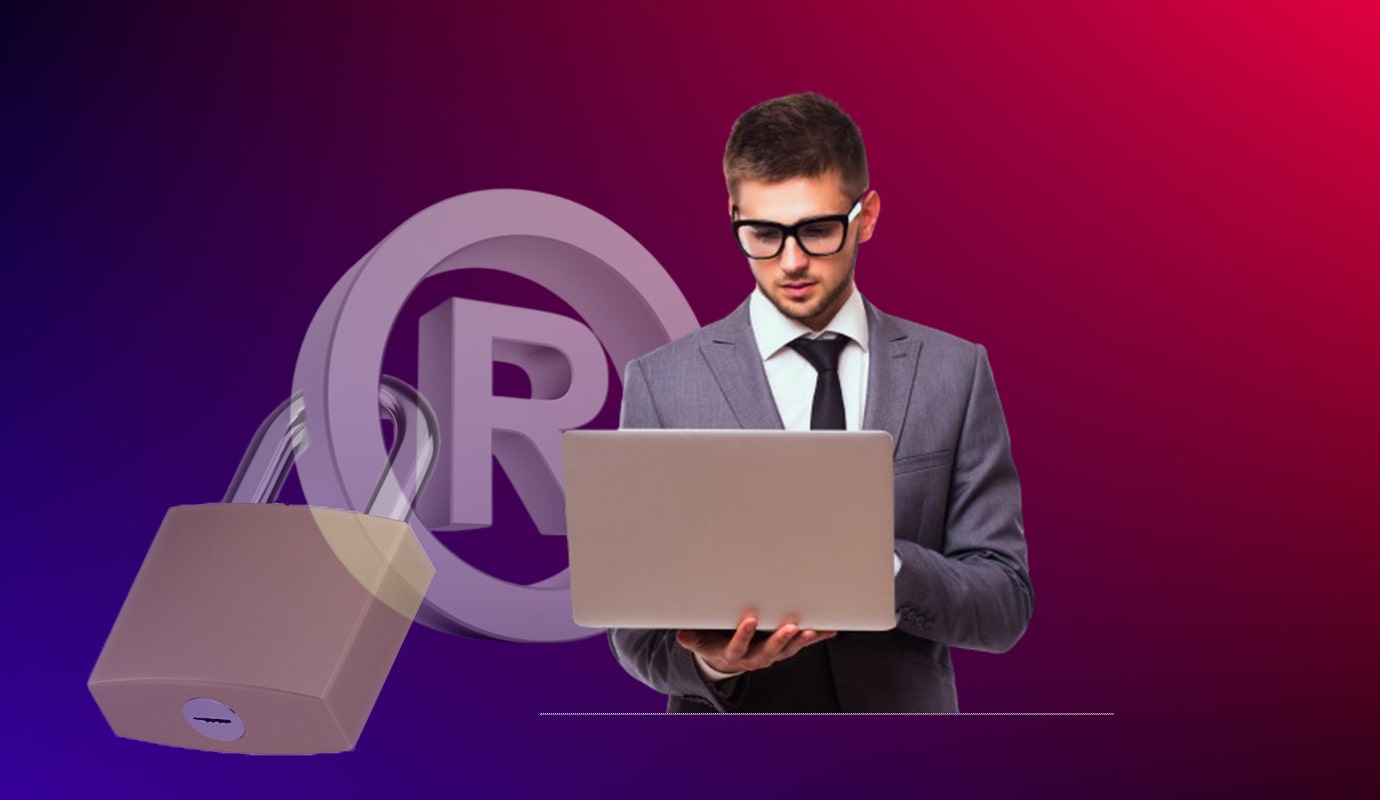 A man wearing glasses and a suit stands looking at a laptop in his hands. In the background, there's a large padlock and a registered trademark symbol, emphasizing the importance of trademark registration. The color gradient of the background is a blend of purple and red.